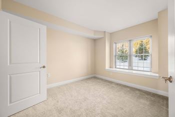 Easy to clean wood inspired flooring and plush carpets throughout